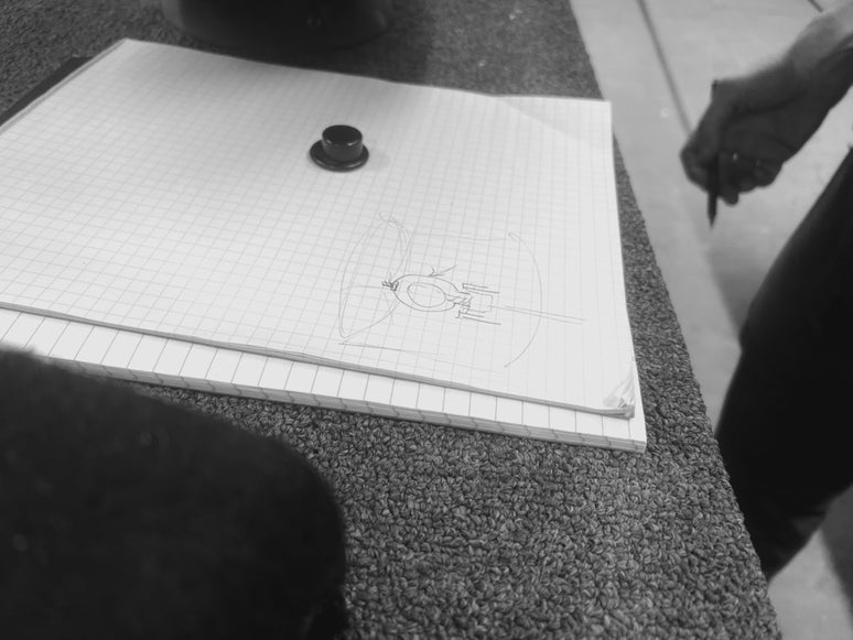 Hands guiding the Verrité design process