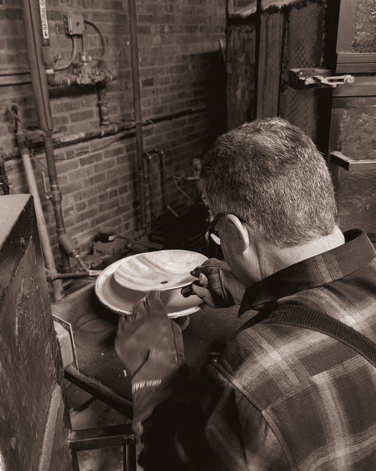 A glass bowl being shaped in one of our ovens